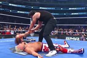 Drew McIntyre dragging Sami Zayn over Cody Rhodes at WWE SmackDown