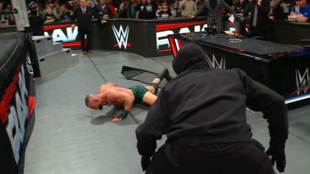 Masked man attacks Austin Theory at WWE RAW
