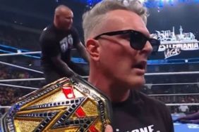Pat McAfee with Cody Rhodes' WWE title with Randy Orton on SmackDown