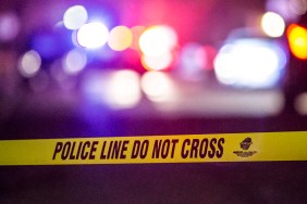 wrestler shooting police caution tape